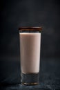 Alcohol cocktail in shot glass with chocolate liqueur and vodka