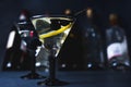 Alcohol cocktail with splash.Dry martini with black olives.Vermouth cocktail inside martini glass over dark background.Martini gla Royalty Free Stock Photo