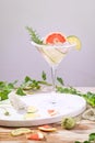 Alcohol drink, gin tonic cocktail with grapefruit, cucumber, rosemary, lime, refreshing, cold drinks with ice on a rustic table. Royalty Free Stock Photo