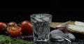 Alcohol drink vodka in shot glass. Surface with snacks Royalty Free Stock Photo
