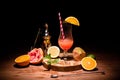 alcohol drink on wooden board with fruits on table