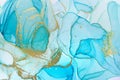 Alcohol ink blue abstract background. Ocean style watercolor texture. Blue and gold paint stains illustration Royalty Free Stock Photo