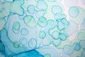 Alcohol ink blue handdrawn watercolor drops on white background. Bubbles imitation.