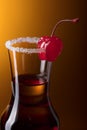 Alcohol layered shot cocktail garnished with cherry . Royalty Free Stock Photo