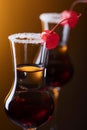 Alcohol layered shot cocktail garnished with cherry . Royalty Free Stock Photo