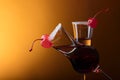 Alcohol layered shot cocktail garnished with cherry and sugar. Royalty Free Stock Photo