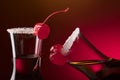 Alcohol layered shot cocktail garnished with cherry and sugar. Royalty Free Stock Photo