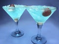 Alcohol liqueur blue curacao cocktails with cherry Royalty Free Stock Photo