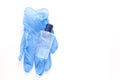 Alcohol liquid sanitizer and blue medical gloves for medical purpose and anti coronavirus COVID-19, white background. Copy space Royalty Free Stock Photo