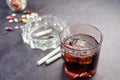 alcohol, pills and cigarette on table Royalty Free Stock Photo