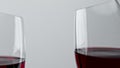 Alcohol red drink clinking wineglasses closeup. Cheering rose wine clear glasses Royalty Free Stock Photo