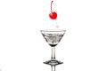 Alcohol or soda bubbles in a martini glass with cherry red