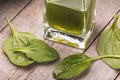 Alcohol tincture of plantain leaves on a wooden table. Medicinal herbs concept