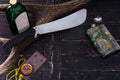 Alcohol and weapons. A tool for cutting cane. Royalty Free Stock Photo
