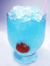 Alcoholic blue curacao cocktail with cherry Royalty Free Stock Photo