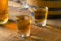 Alcoholic Brown Rum in a Shot Glass Royalty Free Stock Photo