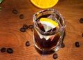 alcoholic cocktail in cristal glass with lemon slices and coffee beans Royalty Free Stock Photo