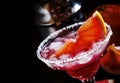 Alcoholic cocktail Greyhound, with vodka, liqueur, grapefruit juice and ice, black background, selective focus