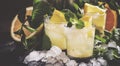 Alcoholic cocktail Morocco smash with Scotch whiskey, sugar syrup, orange, lemon, mint leaves and crushed ice, black background, Royalty Free Stock Photo