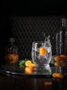 Alcoholic cocktail with a splash on a dark background. Citrus refreshing soda drink in a transparent glass. Royalty Free Stock Photo