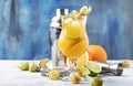 Alcoholic cocktail summer breeze with syrup, lime, orange, beer and ice, selective focus Royalty Free Stock Photo