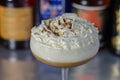 Alcoholic coffee cocktail with a nutty note and whipped cream