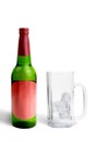 Alcoholic drink bottle and empty glass with ice cubes Royalty Free Stock Photo