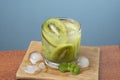 alcoholic drink caipirinha based on kiwi and aguardente distilled cocktail drink and fruits Royalty Free Stock Photo