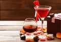 Alcoholic drinks for the festive party. Chocolate candy hearts. Date on Valentines Day