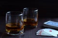 Glass of whiskey with ice on a wooden background. Royalty Free Stock Photo