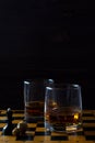 Glass of whiskey with ice on a wooden background. Royalty Free Stock Photo