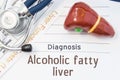 Alcoholic fatty liver diagnosis. Anatomical 3D model of human liver is near stethoscope, results of laboratory tests of liver func