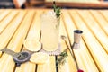 Alcoholic lemonade drink with gin tonic, lime, rosemary and ice served cold at local pub, bar or restaurant. Royalty Free Stock Photo