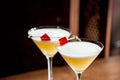 Alcoholic yellow cocktails in martini glasses Royalty Free Stock Photo