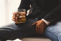 Alcoholism concept. Young man drinking alcohol too much. Alcoholic with a glass of whiskey, Impotence and Erectile dysfunction ED Royalty Free Stock Photo