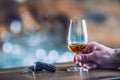 Alcoholism. Cup cognac or brandy hand man the keys to the car an Royalty Free Stock Photo