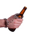 Alcoholism with handcuff and bottle