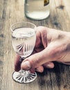 Alcoholism. Man hand alcoholic and drink the distillate Royalty Free Stock Photo