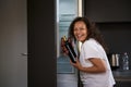 Alcoholism, mental health and social problems. Young curly haired brunette woman with alcohol addiction, holding a Royalty Free Stock Photo