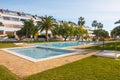 Beautiful holiday resort complex with pools and vibrant palm trees