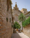 Alcudia, Spain - 9 July, 2023: Sant Jaume Church and castle walls, Alcudia, Mallorca