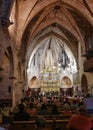 Alcudia, Spain - 9 July, 2023: Sunday service at the Sant Jaume Church in old town Alcudia, Mallorca