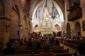 Alcudia, Spain - 9 July, 2023: Sunday service at the Sant Jaume Church in old town Alcudia, Mallorca