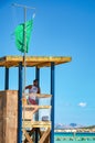 Alcudia, Spain 14.09.2011 - Lifeguard in booth observing people swimming at Playa de Muro beach. Mallorca island famous tourist Royalty Free Stock Photo