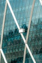 Aldar building with window cleaners Royalty Free Stock Photo