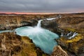 Aldeyjarfoss waterfall in Iceland at sunrise with golden clouds in the sky. Amazing landscape in beautiful tourist attraction. Won