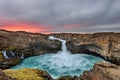 Aldeyjarfoss waterfall in Iceland at sunrise with golden clouds in the sky. Amazing landscape in beautiful tourist attraction. Won