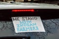 ALDWYCH, LONDON, ENGLAND- 6 December 2020: Car with a poster reading `WE STAND WITH INDIAN FARMERS` at the Kisaan protest,