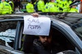 ALDWYCH, LONDON, ENGLAND- 6 December 2020: Man in a car with a sign at the Kisaan protest outside India House, protesting in