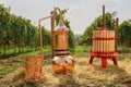 Alembic Copper, barrel and wine press in a vineyard